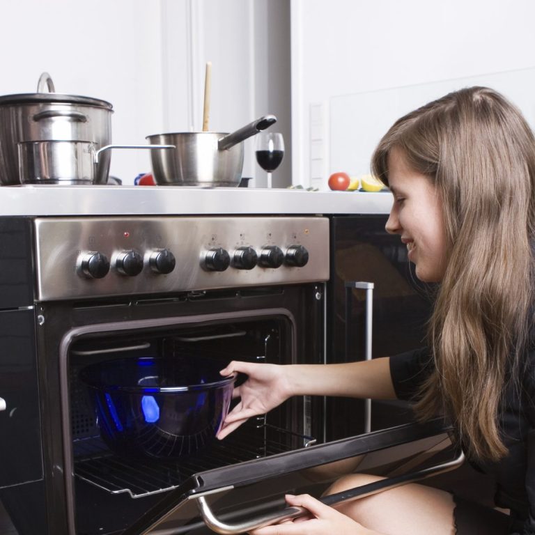 One of our Home Care Givers checking the oven